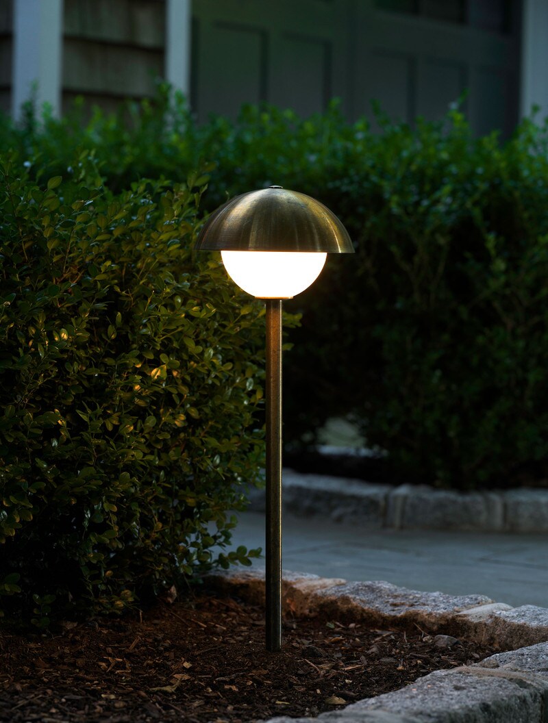Dome Path Light shown in Brass, with organic 30 day patina, and Opal Globe.